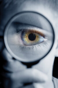 eye behind magnifying glass