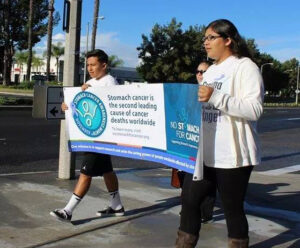 two people holding banner