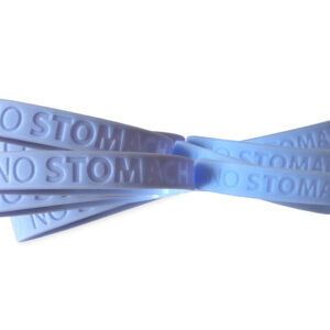a bundle of light blue wristbands that say No Stomach For Cancer